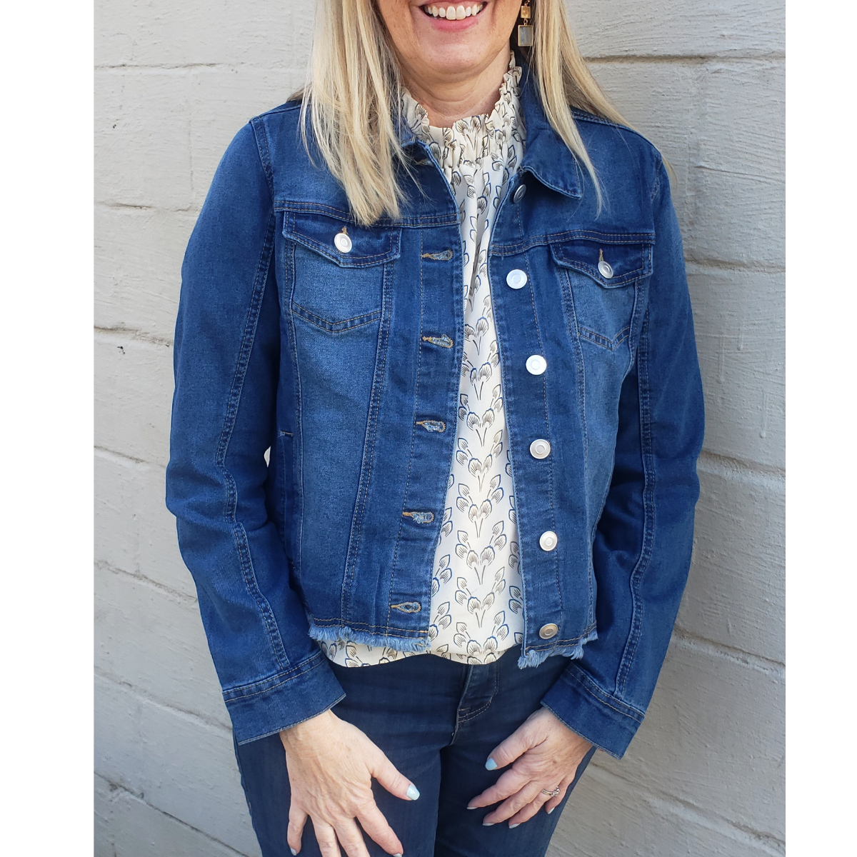 A woman wearing a Ronnie Salloway & Co Inc Denim Jacket with Frayed Hem and jeans.
