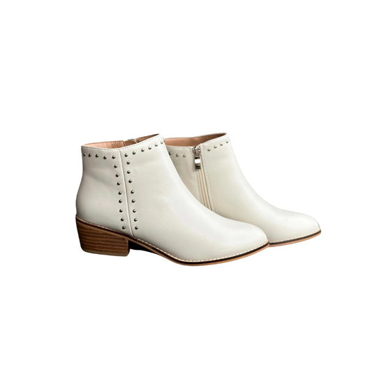 A pair of CORKYS CASANOVA IVORY ankle boots with cute small rivet accents on the side, made by CORKY'S FOOTWEAR INC.