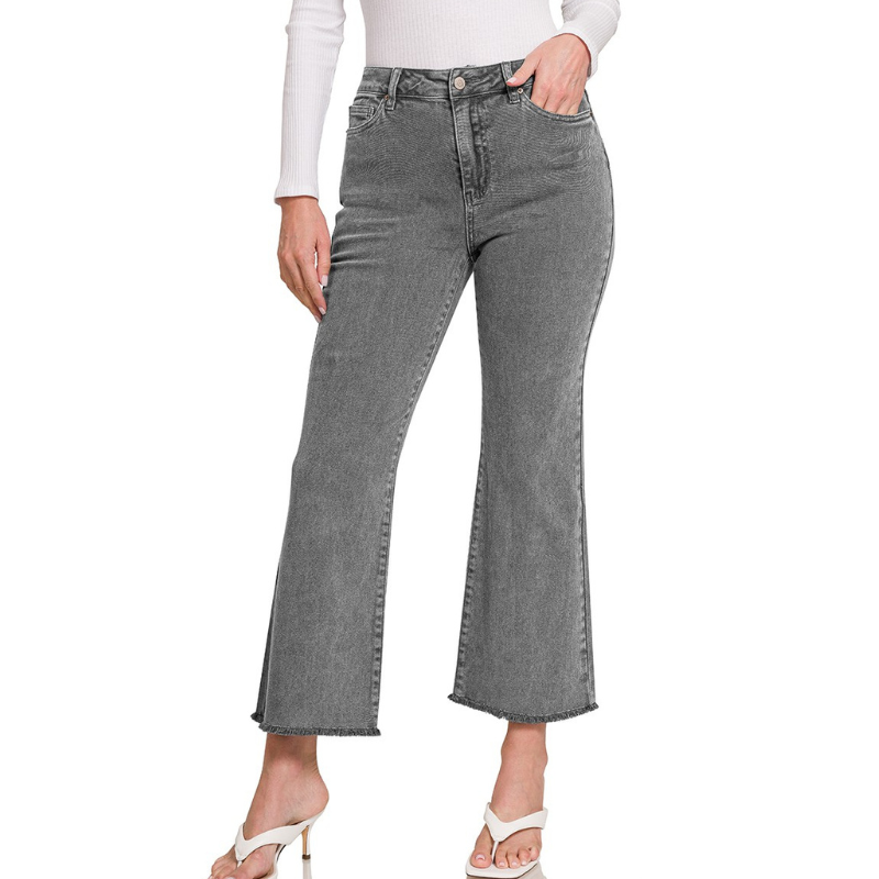 A woman wearing a pair of Zenana ACID WASHED HIGH WAIST FRAYED HEM PANTS in ash blk.