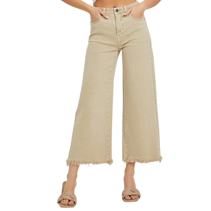 The woman is wearing a pair of RISEN HIGH RISE TUMMY CONTROL WIDE LEG CROPPED - khaki pants with a cropped frayer hem.