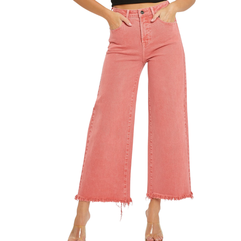 A woman wearing RISEN HIGH RISE TUMMY CONTROL FRAYED CROP - peach blossom denim pants.