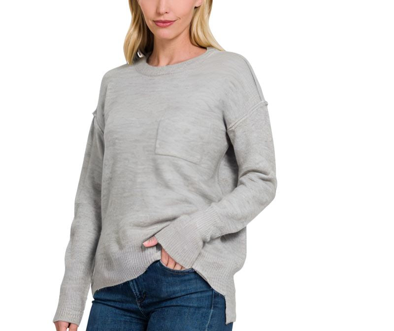 A woman wearing a Zenana Melange Sweater.