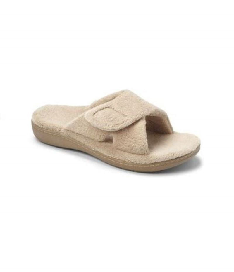 These VIONIC RELAX TAN women's slippers feature dual straps for an adjustable fit and arch support for comfort.